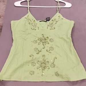 Green spaghetti strap blouse
